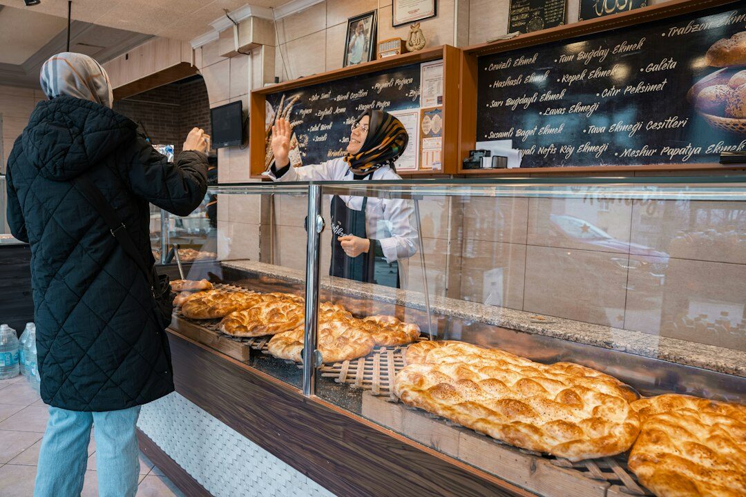 baker making bread in shop