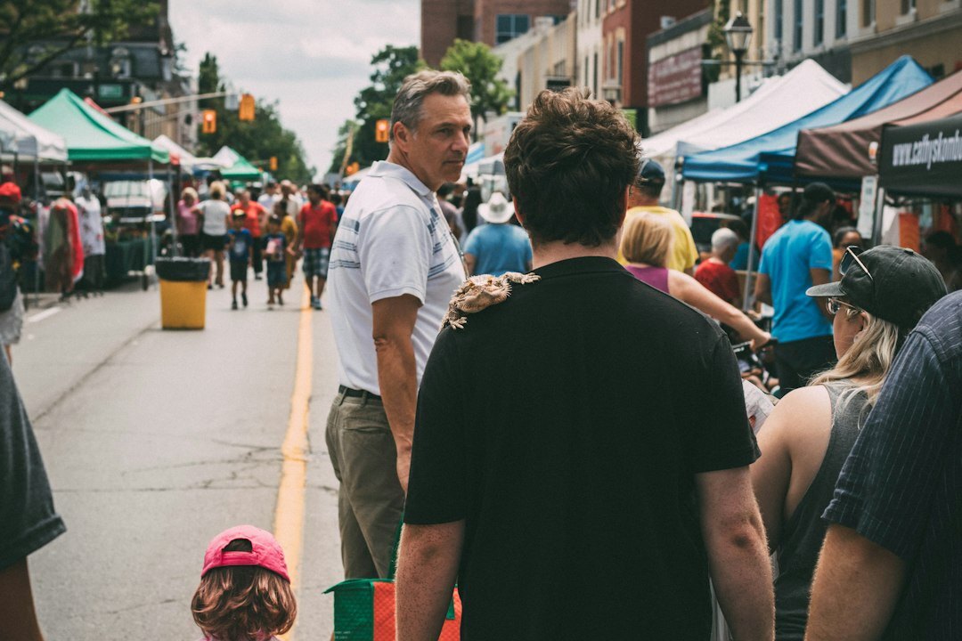 Local community market street scene with people talking