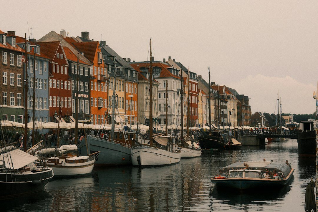 Fishing boats docked at a small Danish harbor