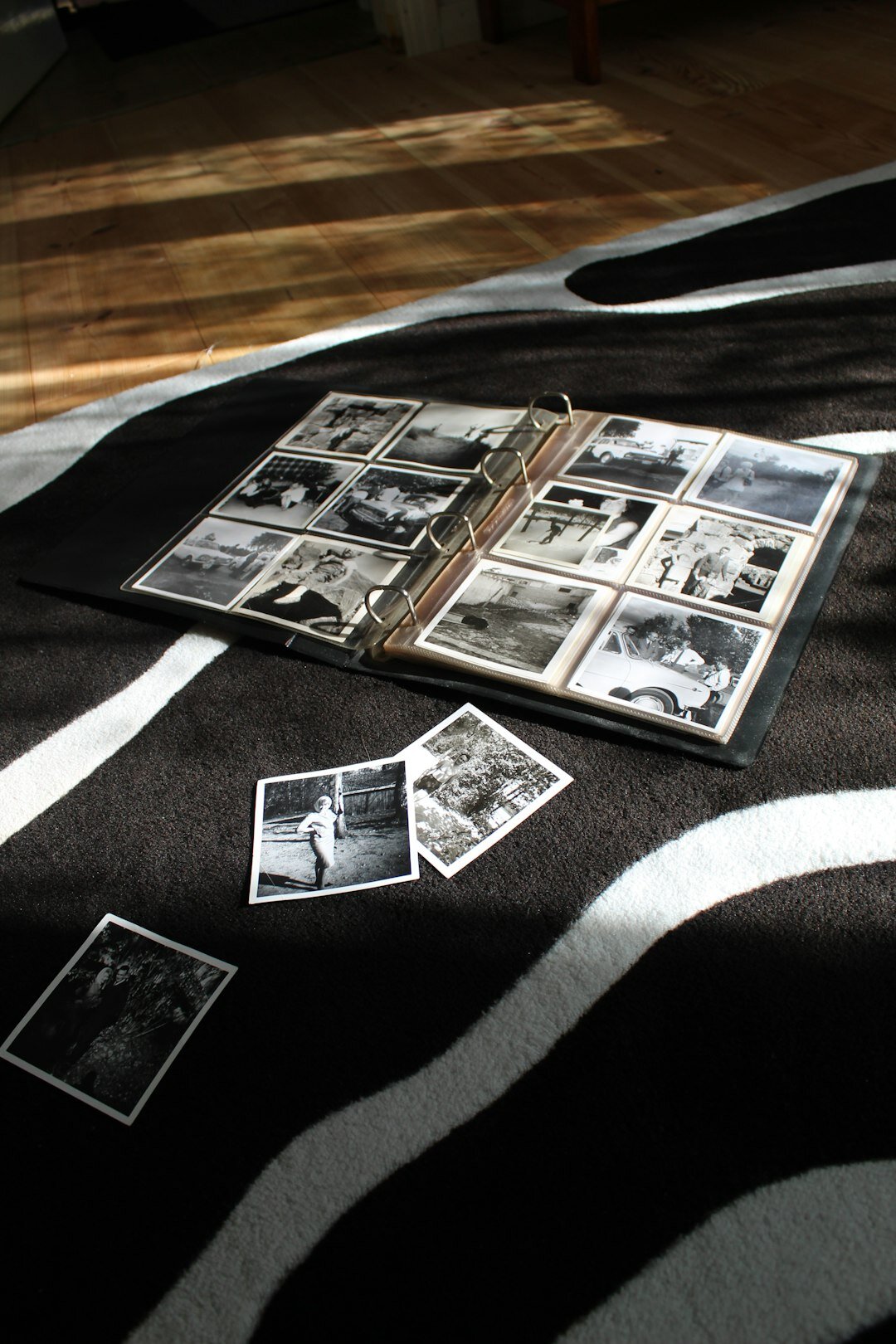 Open photo book with printed documentary photographs