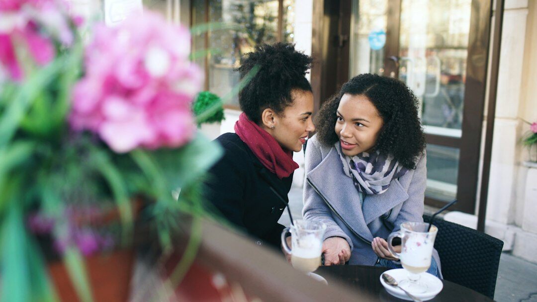 Two people having a warm conversation outdoors