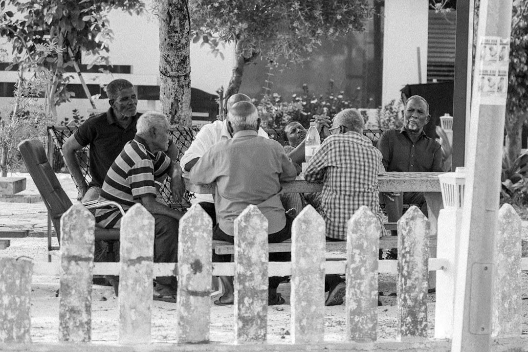 Black and white documentary photo of a local community gathering