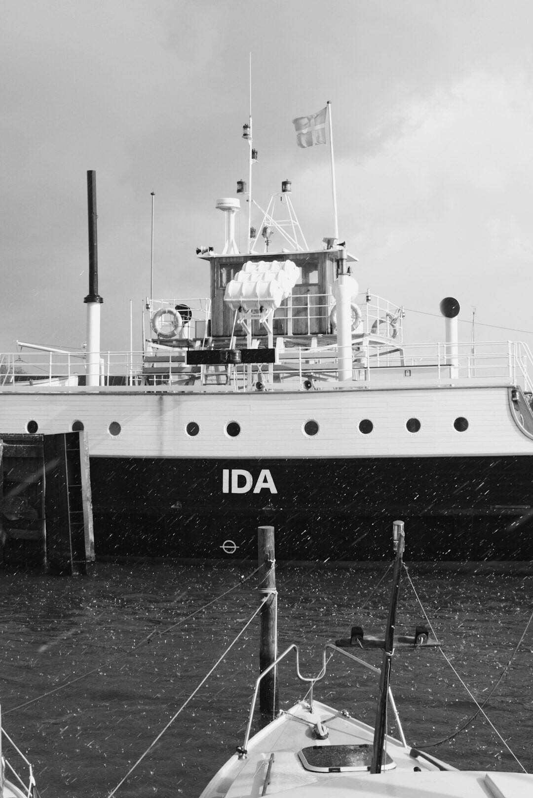 Fishing boats moored close together at a Danish harbor
